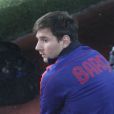 Lionel Messi sur le banc des remplaçants pour cause de blessure lors de FC Barcelone-PSG à Barcelone le 10 avril 2013.