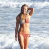L'ex-Playmate de 26 ans Nikki Leigh, en bikini pour un shooting avec le photographe Estevan Oriol sur une plage de Santa Monica. Le 14 mai 2013.