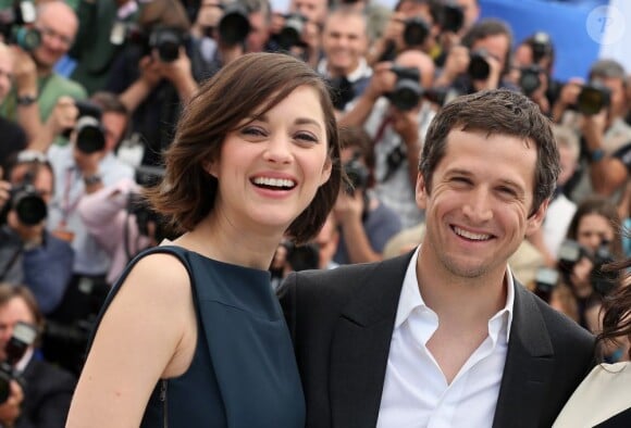 Marion Cotillard et Guillaume Canet pendant le photocall du film Blood Ties au 66e Festival du film de Cannes, le 20 mai 2013.
