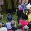 Kate Middleton, enceinte de 7 mois et rayonnante dans un manteau Emilia Wickstead, prenait part à la garden party du 22 mai 2013 offerte à Buckingham par la reine Elizabeth II.