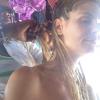 Heidi Klum se fait tresser les cheveux lors de ses vacances aux Bahamas. Juillet 2013
