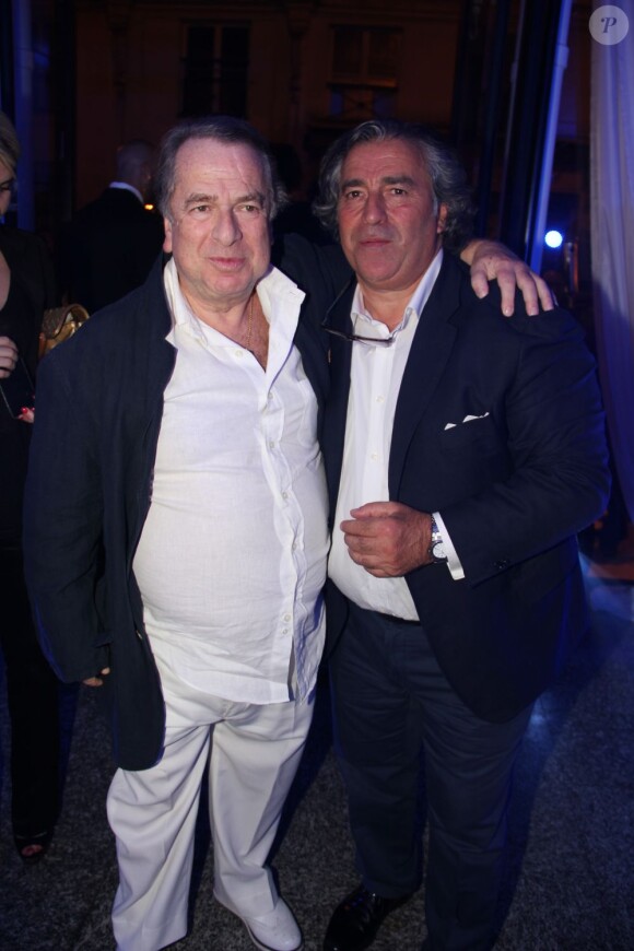 Paul-Loup Sulitzer et Sam Rone à la soirée de lancement de la collection Sam-Rone prêt-à-porter printemps/été 2014-2015, à Paris, le 7 juillet 2013.