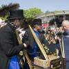 Le prince Charles et Camilla Parker Bowles le 11 juillet 2013 au premier jour du Coronation Festival organisé à Buckingham Palace, à l'occasion des 60 ans du couronnement d'Elizabeth II, par la Royal Warrants Holders Association.