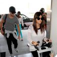 Kourtney Kardashian, son mari Scott Disick et leurs enfants Mason et Penelope à l'aéroport LAX de Los Angeles, le 19 juillet 2013.