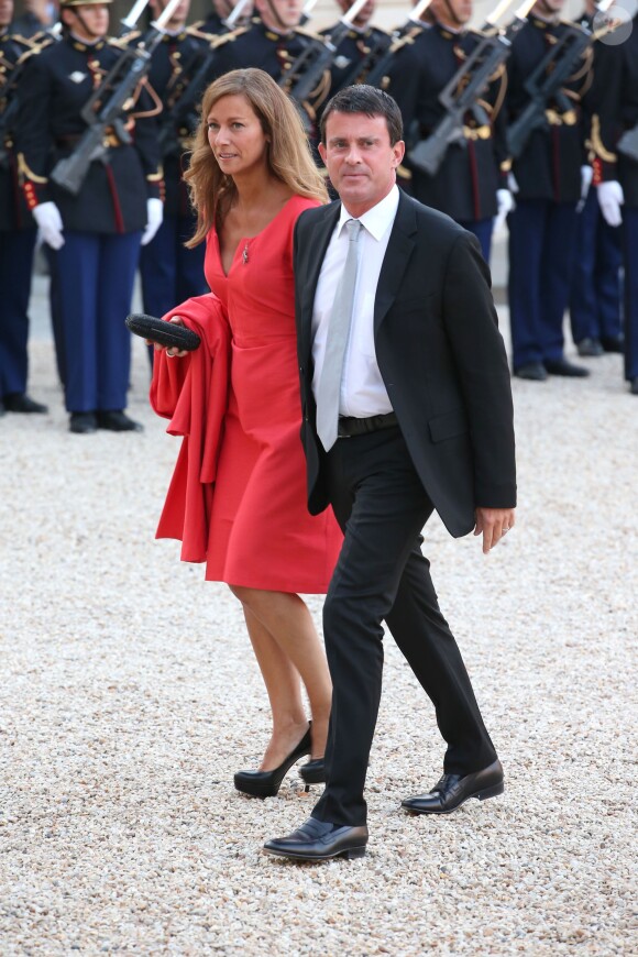Manuel Valls et son épouse violoniste Anne Gravoin lors d'un dîner d'Etat à l'Elysée le 3 septembre 2013.