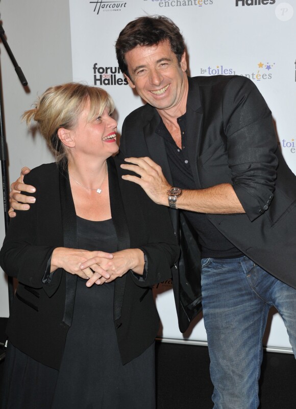 Patrick Bruel et Isabelle Nanty, parrain et marraine, inauguraient avec joie l'expo photo Stars parmi les stars organisée par le Studio Harcourt et le Forum des Halles au profit de l'association Les Toiles Enchantées, le 19 septembre 2013 à Paris.
