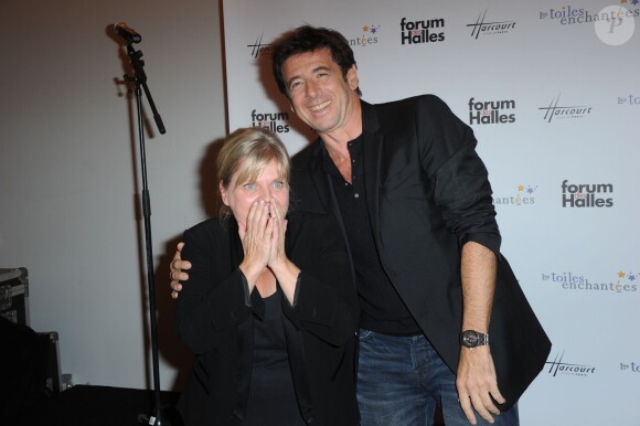 Patrick Bruel et Isabelle Nanty, parrain et marraine, inauguraient avec joie l'expo photo Stars parmi les stars organisée par le Studio Harcourt et le Forum des Halles au profit de l'association Les Toiles Enchantées, le 19 septembre 2013 à Paris.