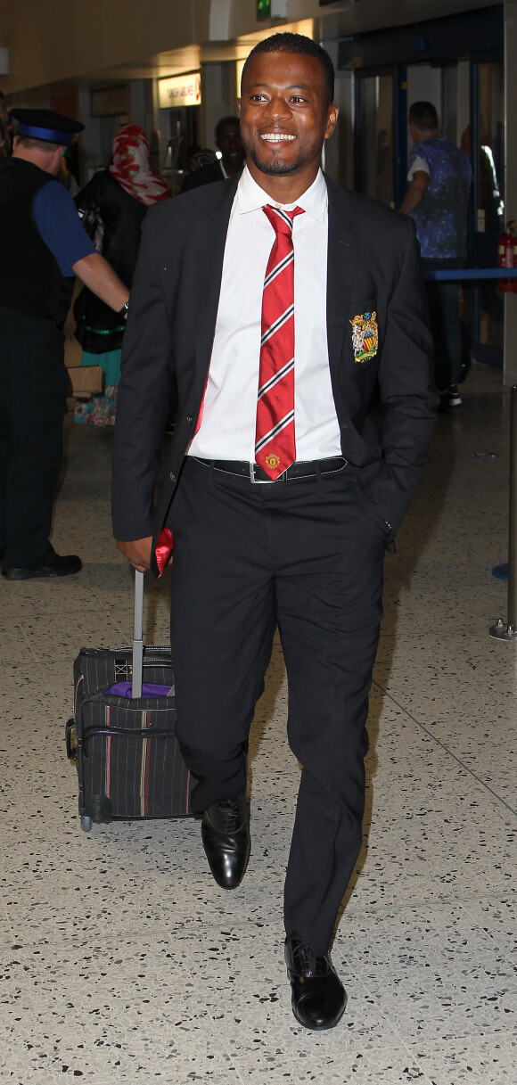 Patrice Evra à l'aéroport de Manchester, le 5 août 2013