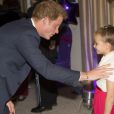 Le prince Harry avec la jeune Madison Kirk lors de la soirée des WellChild Awards le 11 septembre 2013 à Londres.
