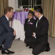 Le prince Harry avec le jeune Jonathan He lors de la soirée des WellChild Awards le 11 septembre 2013 à Londres.