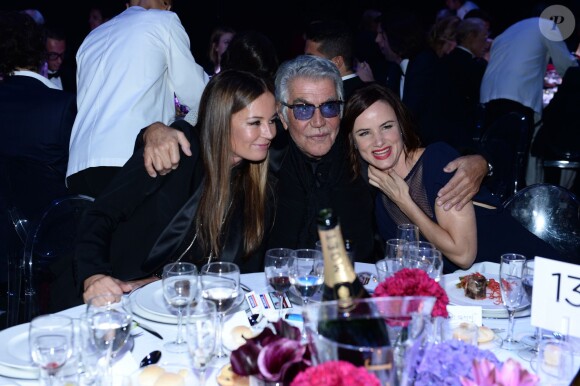 Eva et Roberto Cavalli au côté de Lewis Juliette lors du gala de l'amfAR à Milan, le 21 septembre 2013.