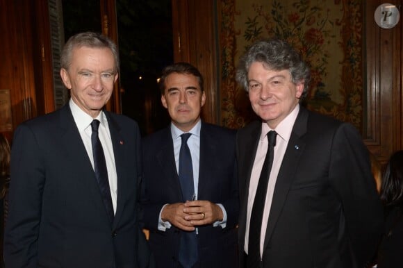 Bernard Arnault, Alexande de Juniac et Thierry Breton à la soirée des 80 ans d'Air France, à Paris, le 7 octobre 2013.