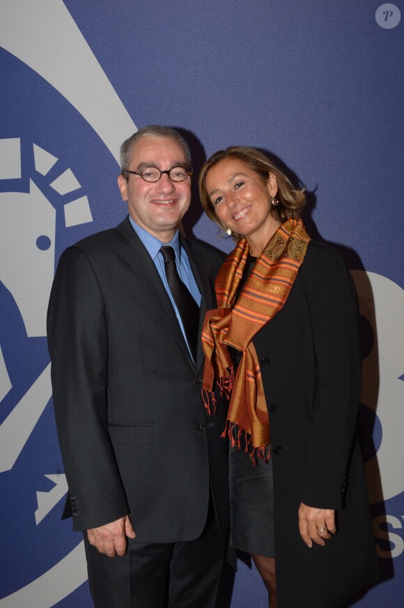 Emmanuel Hoog (PDG d'AFP) et sa femme à la soirée des 80 ans d'Air France, à Paris, le 7 octobre 2013.