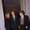 Bernard Arnault et son épouse avec Thierry Breton à la soirée des 80 ans d'Air France, à Paris, le 7 octobre 2013.