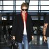 Exclusif - Gwyneth Paltrow arrive à l'aéroport de Los Angeles, habillée d'un manteau Alice + Olivia, un top blanc, un jean AG Adriano Goldschmied, un sac Jason Wu (modèle Jourdan 2) et des souliers "Intern" par Christian Louboutin. Le 17 octobre 2013.