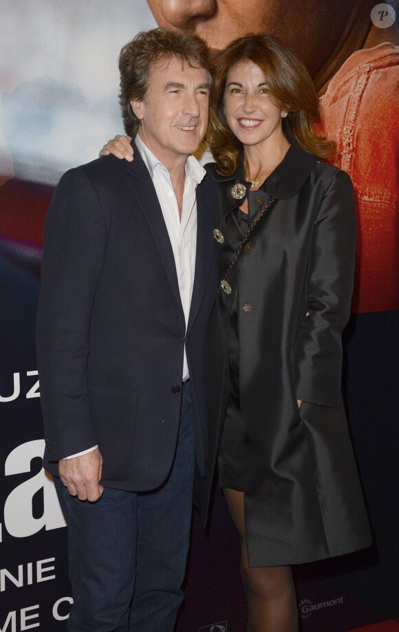 François Cluzet et sa femme Narjiss à l'avant-première du film "En solitaire" au cinéma Gaumont Opéra à Paris, le 4 novembre 2013.