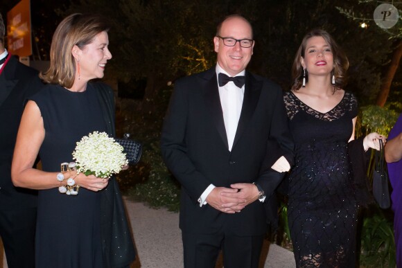 La princesse Caroline de Hanovre, le prince Albert II de Monaco et Charlotte Casiraghi, enceinte au dîner organisé par les Amis du Nouveau Musée National de Monaco à la Villa Paloma, le 17 septembre 2013.