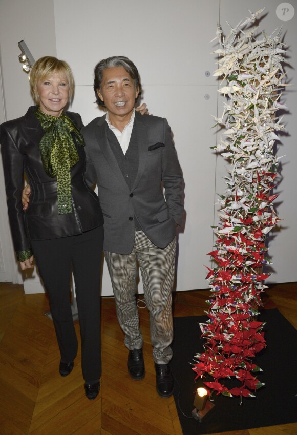 Marie-Christiane Marek et Kenzo Takada lors de la 18e édition de l'opération Sapins de Noël des Créateurs à l'hôtel Salomon de Rothschild à Paris, le 3 décembre 2013.