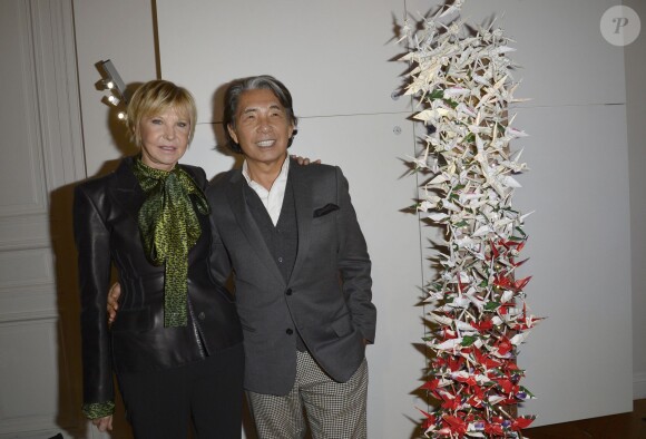 Marie-Christiane Marek et Kenzo Takada lors de la 18e édition de l'opération Sapins de Noël des Créateurs à l'hôtel Salomon de Rothschild à Paris, le 3 décembre 2013.
