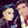 Demi Lovato avec Simon Cowell sur le plateau de l'émission X Factor 2013.