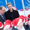 Le prince Albert II de Monaco et la princesse Charlene ont fêté le Noël des enfants au palais princier à Monaco, le 18 décembre 2013.