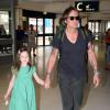 Nicole Kidman et Keith Urban à l'aéroport de Sydney en Australie avec leurs enfants Faith Margaret et Sunday Rose, en route pour les Etats-Unis, le 2 janvier 2014 : le chanteur tient par la main sa fille Sunday Rose qui a bien grandi !