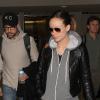Olivia Wilde (enceinte) et son fiancé Jason Sudeikis arrivent à Los Angeles en provenance de New York, le 5 janvier 2014.