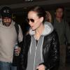 Olivia Wilde (enceinte) et son fiancé Jason Sudeikis arrivent à Los Angeles en provenance de New York, le 5 janvier 2014.
