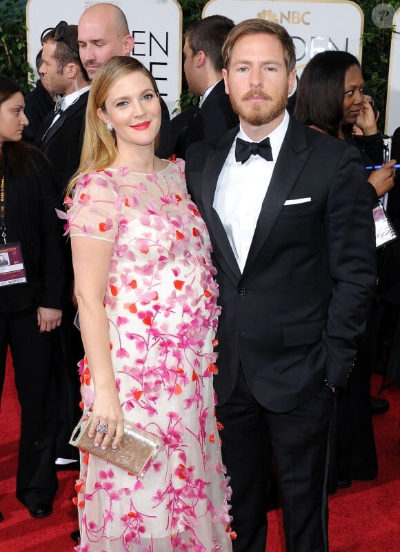 Drew Barrymore enceinte au côté de son mari lors des Golden Globes à Beverly Hills le 12 janvier 2014.