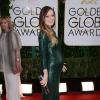Olivia Wilde enceinte et habillée d'une robe Gucci aux Golden Globe Awards à Beverly Hills, Los Angeles, le 12 janvier 2014.