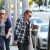 Johnny et Laeticia Hallyday se promenent a Los Angeles le 13 janvier 2014. Johnny et Laeticia ont deguste une glace avec leurs filles.  French singer Johnny Hallyday and his wife Laeticia sighting in Los Angeles on january 13, 2014.13/01/2014 - Los Angeles