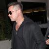 Brad Pitt, 50 ans et avec sa nouvelle coupe de cheveux, à l'aéroport LAX à Los Angeles, le 17 janvier 2014.