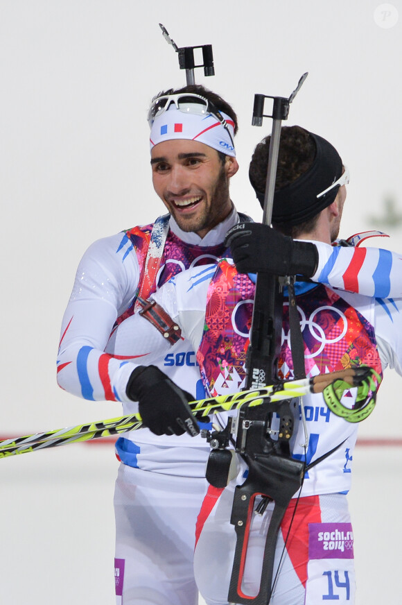 Martin Fourcade et Jean-Guillaume Béatrix après l'épreuve de poursuite lors des JO de Sotchi, au Laura Cross-country Ski & Biathlon Center de Krasnaya Polyana, le 10 février 2014