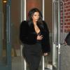 Kim Kardashian quitte l'appartement de son fiancé Kanye West à New York, le 16 février 2014.
