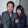 Christophe Michalak et sa femme Delphine McCarty (enceinte) assistent au défilé de mode "Alexis Mabille", collection prêt-à-porter Automne-Hiver 2014/2015, à Paris. Le 26 février 2014.