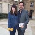 Christophe Michalak et sa femme Delphine McCarty (enceinte) au défilé de mode "Alexis Mabille", collection prêt-à-porter Automne-Hiver 2014/2015, à Paris. Le 26 février 2014.