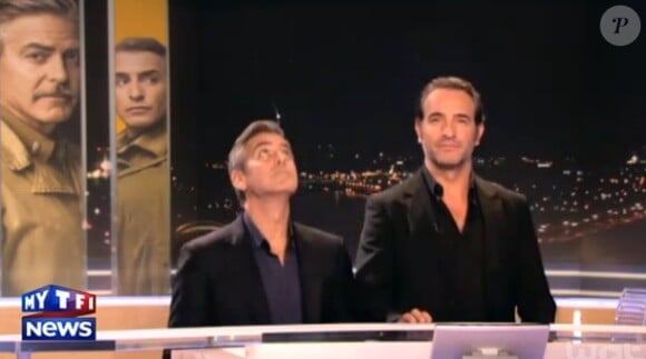 George Clooney et Jean Dujardin miment la descente d'ascenseurs avant de tourner une interview pour le journal télévisé de TF1.