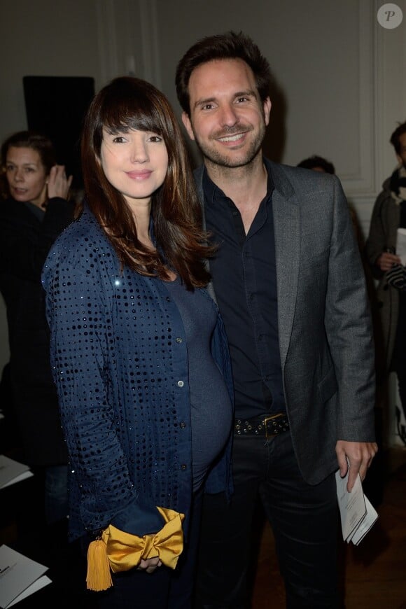 Christophe Michalak et Delphine McCarty lors du défilé Alexis Mabille à l'hôtel Salomon de Rothschild à Paris, le 26 février 2014