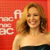 Kylie Minogue en séance de dédicaces exceptionnelle à la FNAC Saint-Lazare pour la sortie de son nouvel album "Kiss me Once" le 19 mars 2014.