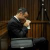 Oscar Pistorius, sur le banc des accusés du tribunal de Pretoria, le 18 mars 2014