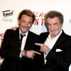 Johnny Hallyday et Eddy Mitchell complices à l'avant-première du film Salaud on t'aime à l'UGC Normandie sur les Champs-Elysées à Paris le 31 mars 2014.