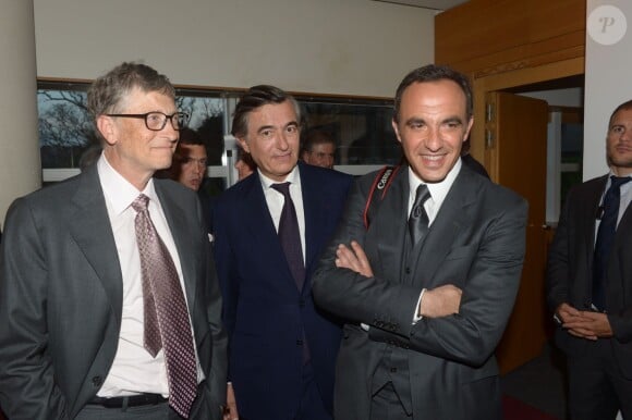 Bill Gates, Philippe Douste-Blazy et Nikos Aliagas au dîner en l'honneur d'UNITAID au Conseil économique, social et environnemental à Paris, le 1er avril 2014.