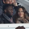 Thomas N'Gijol et sa compagne enceinte Karole Rocher lors du match entre le PSG et Marseille au Parc des Princes à Paris le 2 mars 2014.
