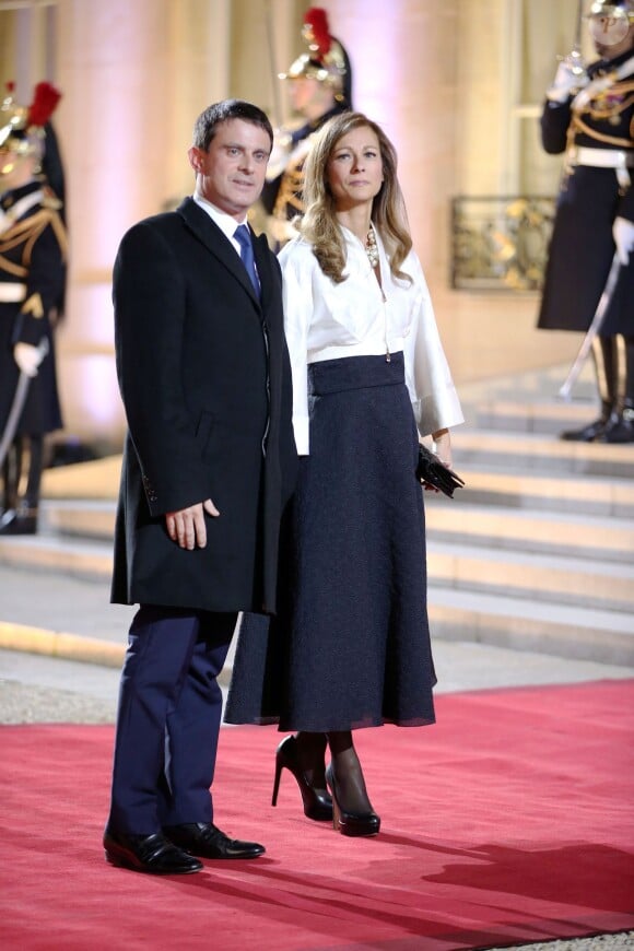 Manuel Valls et sa femme Anne Gravoin à l'Elysée pour le Sommet pour la Paix et la sécurité en Afrique le 6 décembre 2013.