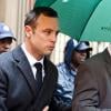 Oscar Pistorius lors de son arrivée à la Haute cour de justice de Pretoria où il doit répondre du meurtre de Reeva Steenkamp, le 10 mars 2014
