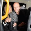 Rosie Huntington-Whiteley et Jason Statham montent à bord d'un taxi après avoir dîné au restaurant Nobu. Londres, le 26 avril 2014.