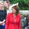 Carole Middleton était superbe en rouge et beige au mariage de Rowena Macrae, très bonne amie de sa fille Pippa, et Julian Osborne à Pertshire, en Ecosse, le 26 avril 2014.