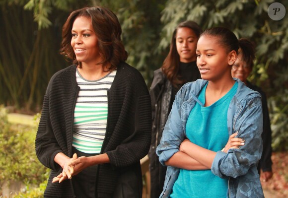 Malia et Sasha en Chine avec leur maman, Michelle Obama, mars 2014. 