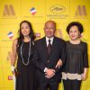 John Woo avec sa femme Annie et sa fille Wu Feixia - Soirée d'ouverture du "Marché du film" sur la plage du Majestic lors du 67e festival du film de Cannes le 15 mai 2014