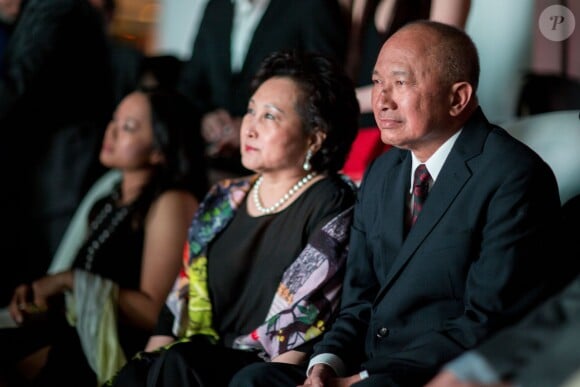 John Woo avec sa femme Annie et sa fille Wu Feixia - Soirée d'ouverture du "Marché du film" sur la plage du Majestic lors du 67e festival du film de Cannes le 15 mai 2014